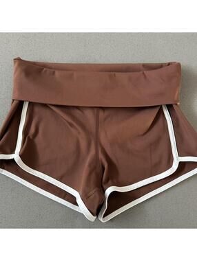 Free People Movement brown shorts with white trim
